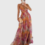 Lange maxi jurk met romantische bloemenprint, hoge taille en gekruiste bandjes