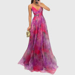 Lange maxi jurk met romantische bloemenprint, hoge taille en gekruiste bandjes