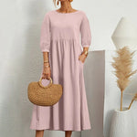 Elegante jurk met ronde hals, 3/4 mouwen, getailleerde taille en vloeiende rok