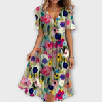 Elegante jurk met V-hals, aansluitend silhouet en soepel vallende nette stof