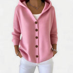 Ruimvallend gebreid vest met knopen voor dames, gedragen over een effen top en een jeans